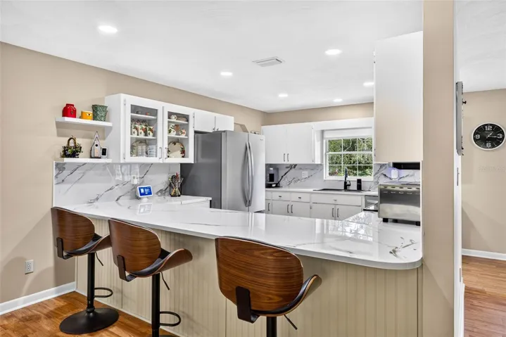 Large open kitchen with loads of cabinets