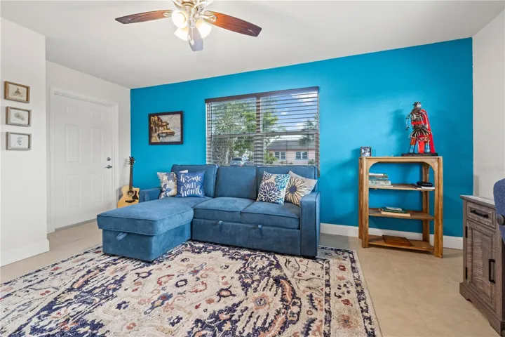 The third bedroom is off the living room  It also has it's own private entry to the outside lanai.  It has a walk-in closet.