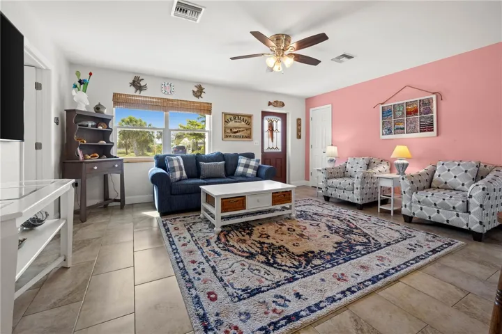 Throughout the home are well maintained ceramic tile.  The living room is bright and spacious.