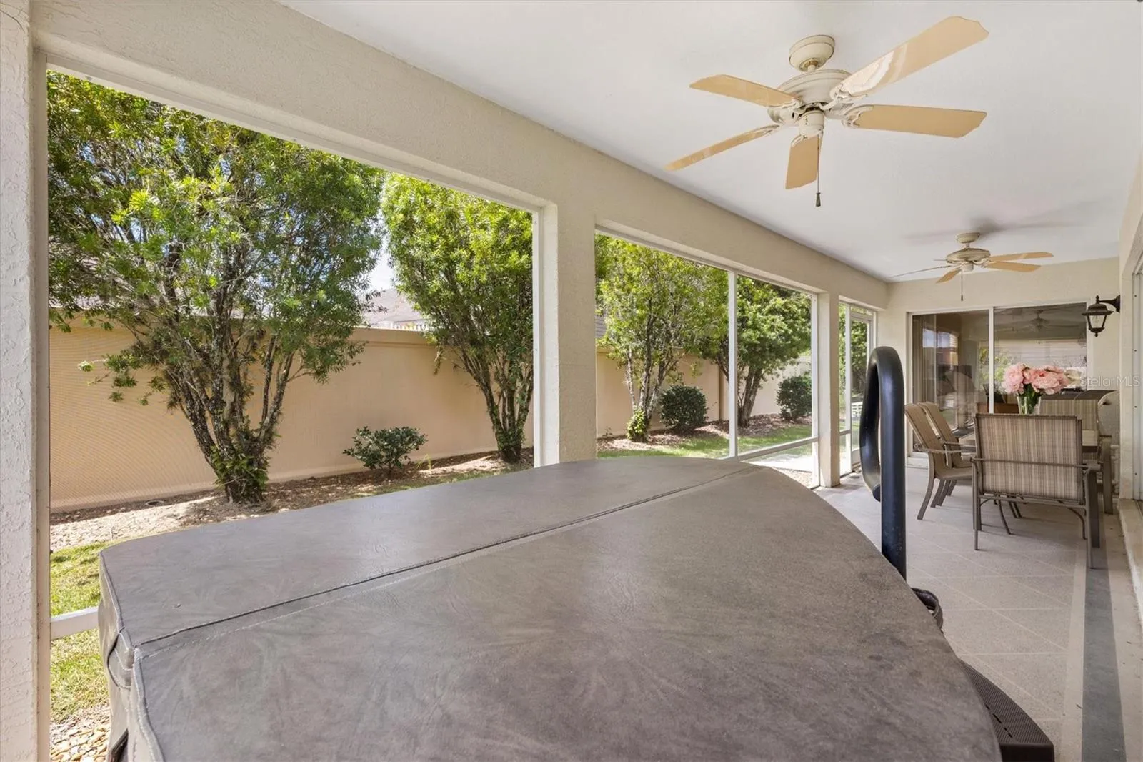 Hot tub on lanai and privacy wall in back