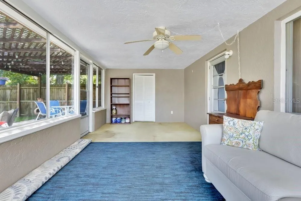Florida room with laundry utility door in back