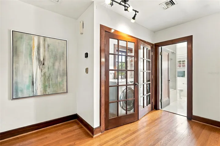 Second Floor Laundry behind French Doors and Full Bathroom