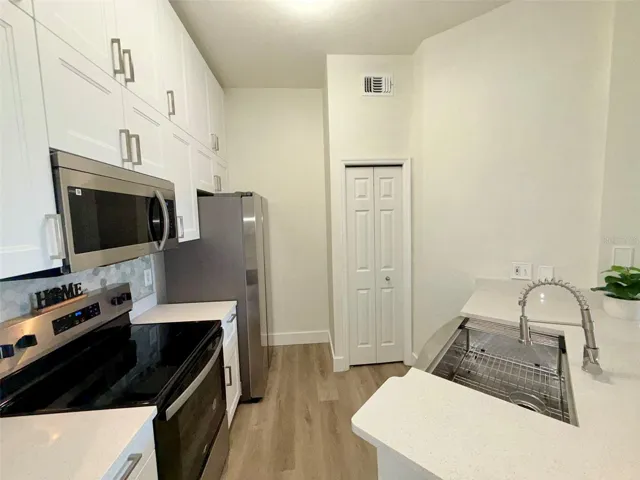 New stainless steel appliances and pantry