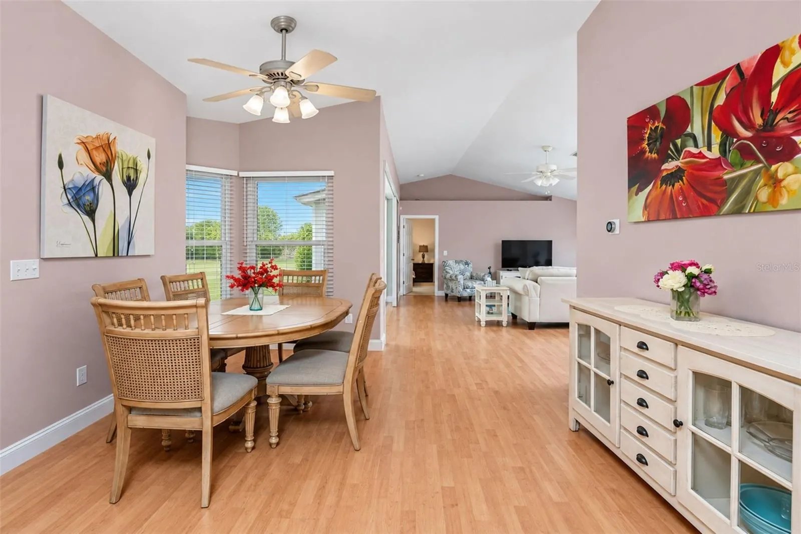 The dining area is adjoining  the living room and kitchen.