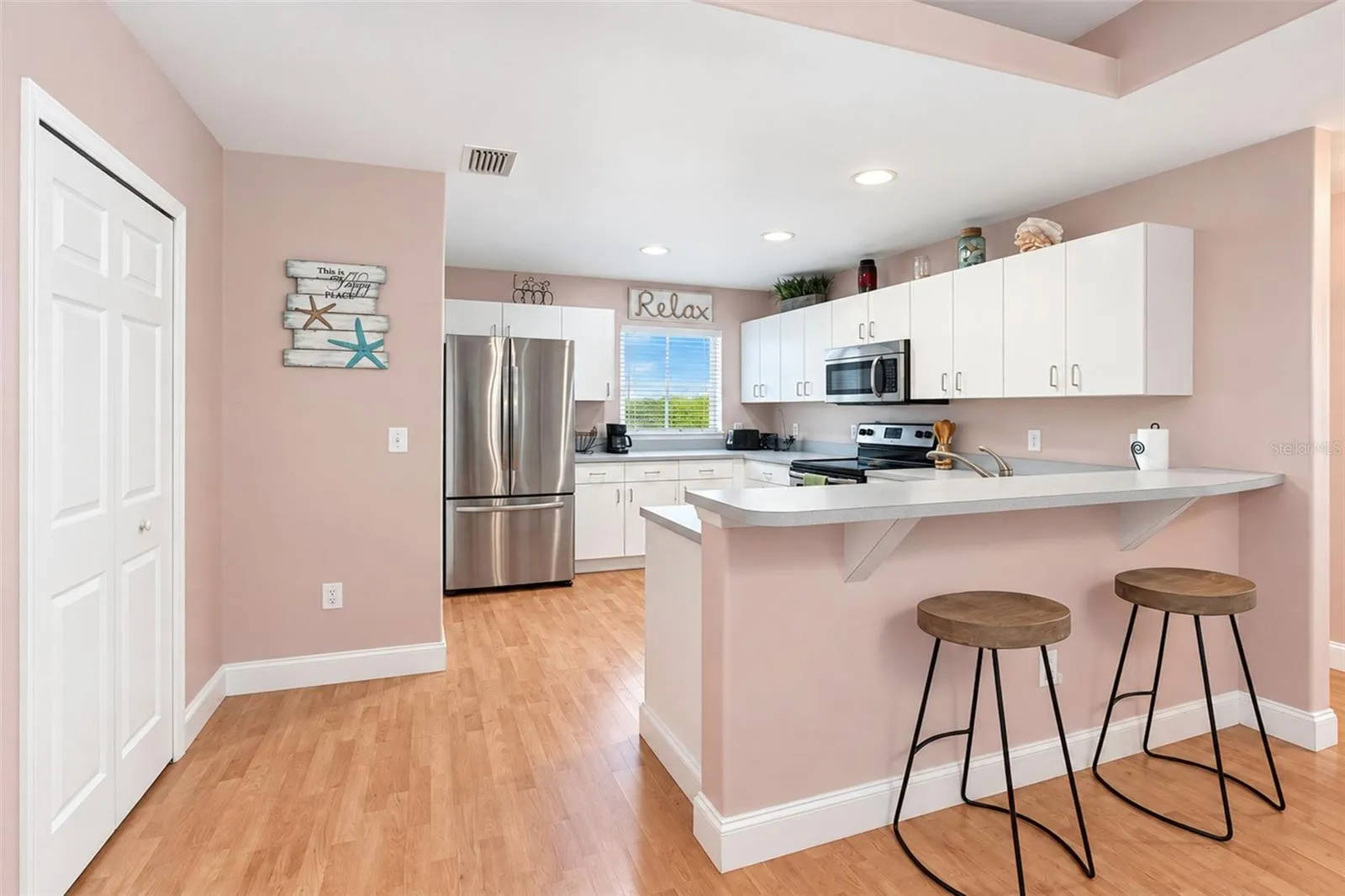 The pantry closet and breakfast bar are a nice convenience.