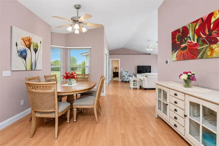 The dining area is adjoining  the living room and kitchen.