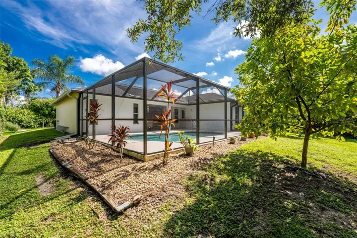 A view from your peaceful backyard into the lanai .