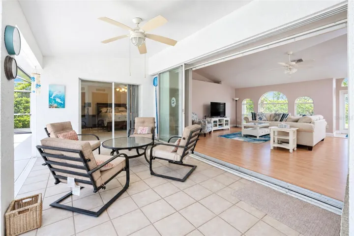 The covered lanai has access from the living room and primary bedroom for convenience.