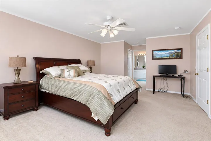 The primary suite is spacious and flows into the en-suite bathroom.
