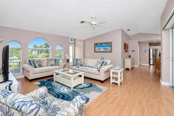 The cathedral ceiling provides a bright and spacious feeling to the living room.