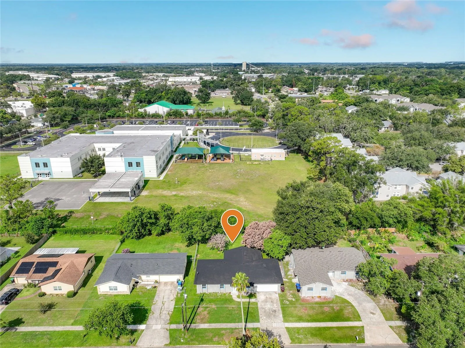 Aerial view of the home and surrounding neighborhood