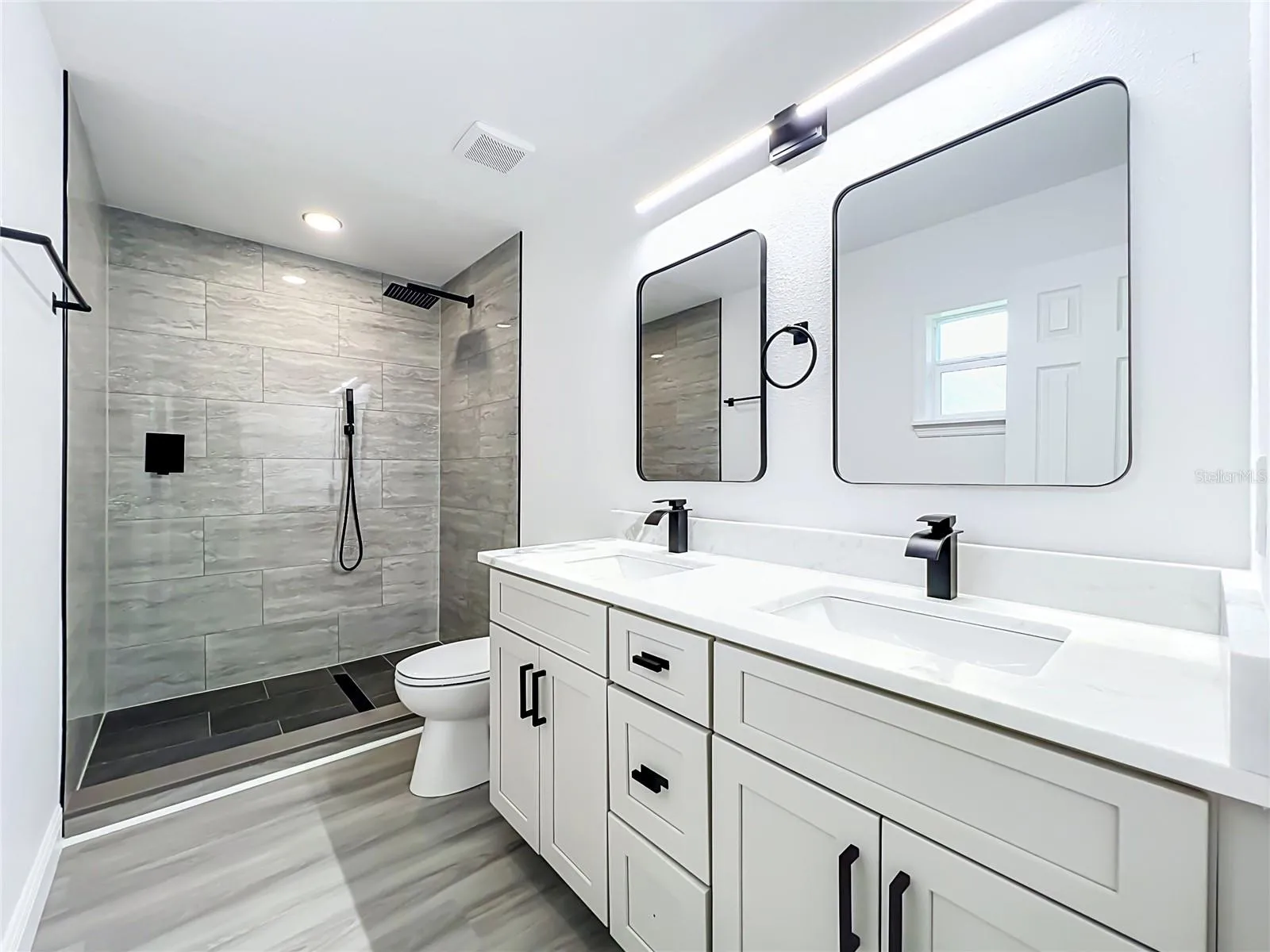 Updated vanity and spacious walk-in shower