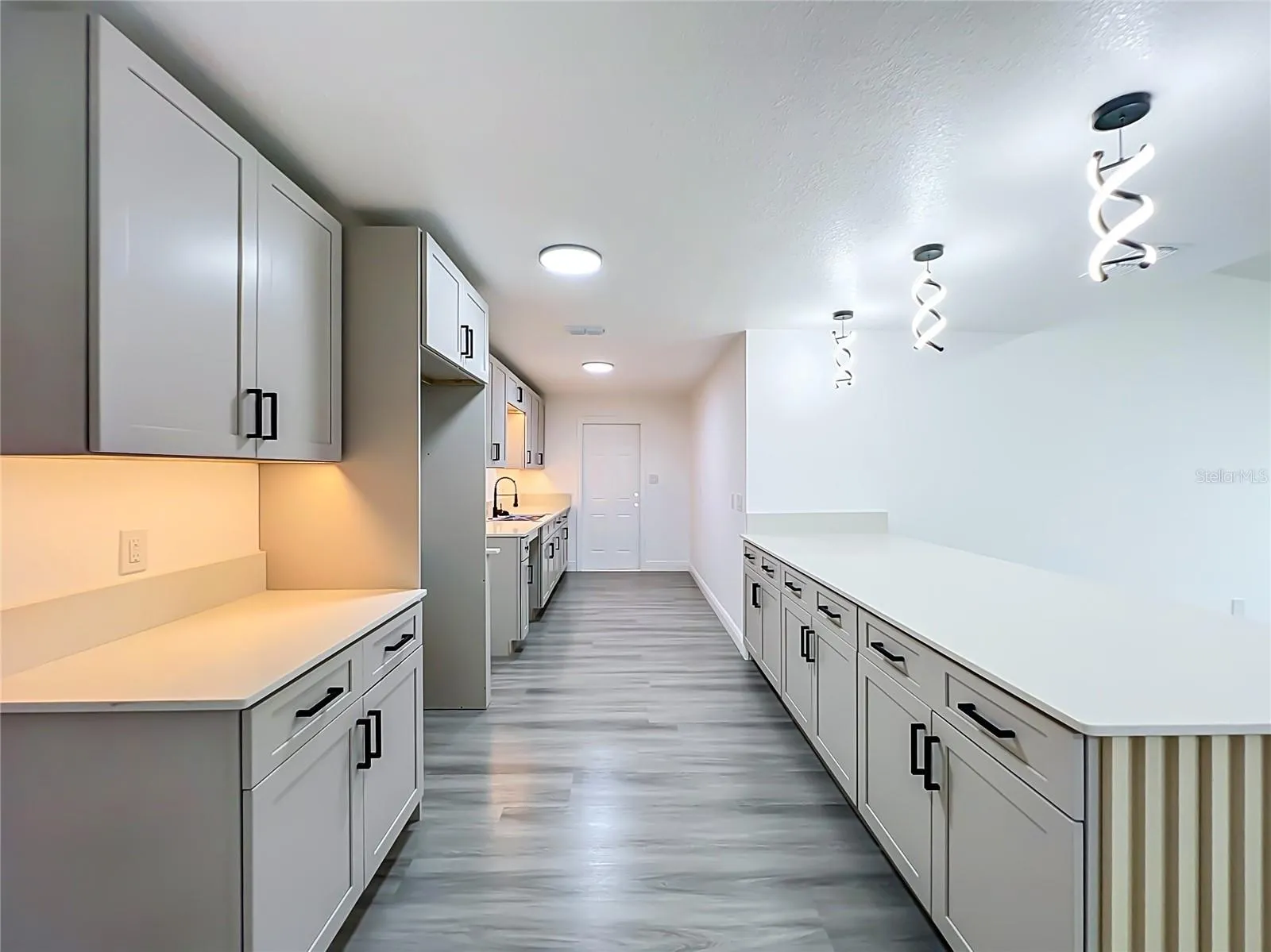 Beautiful updated kitchen with oversized island. Buyer may choose a $3,000 appliance credit or seller-installed appliances prior to closing.