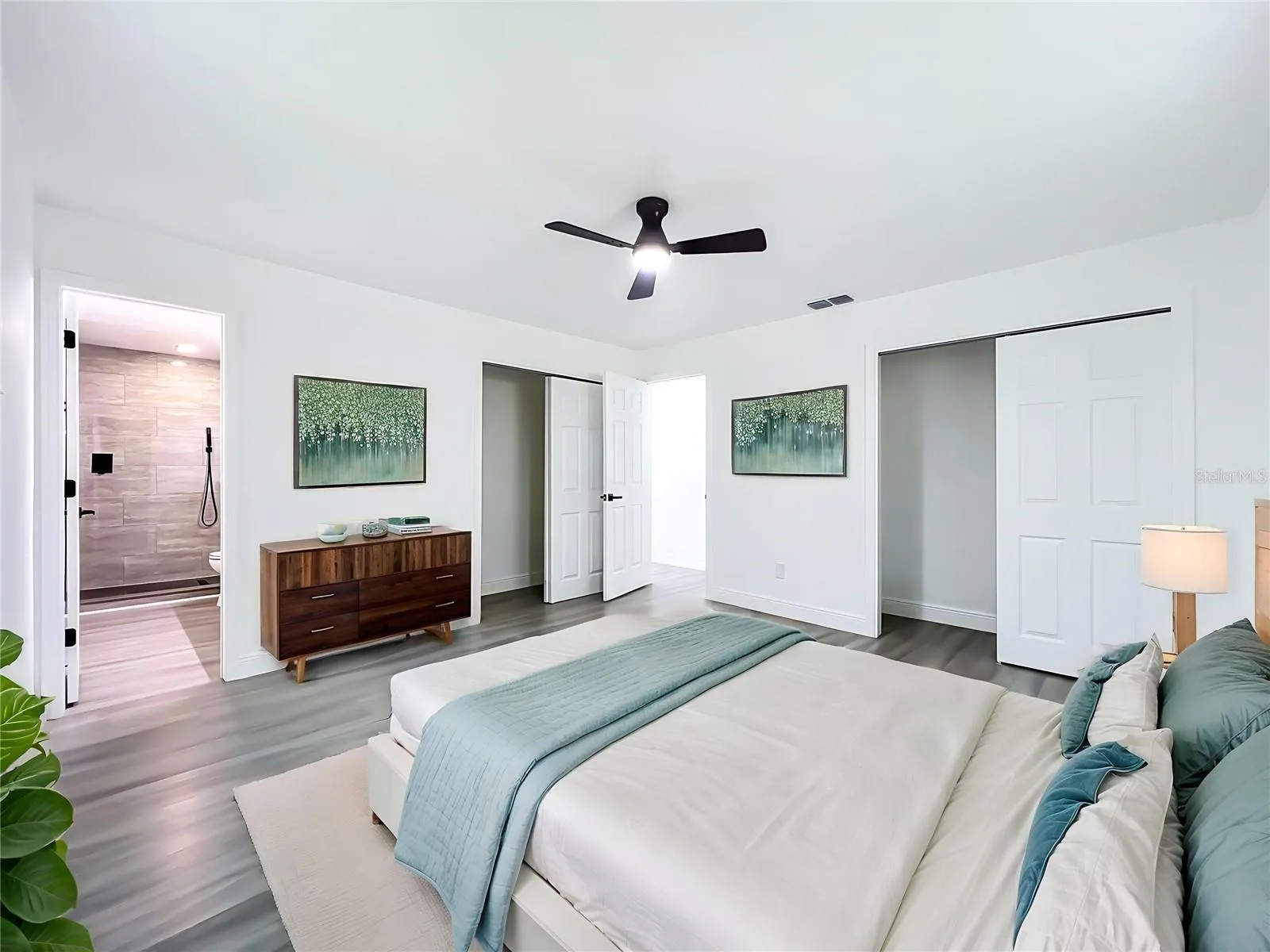 Spacious primary bedroom with modern finishes