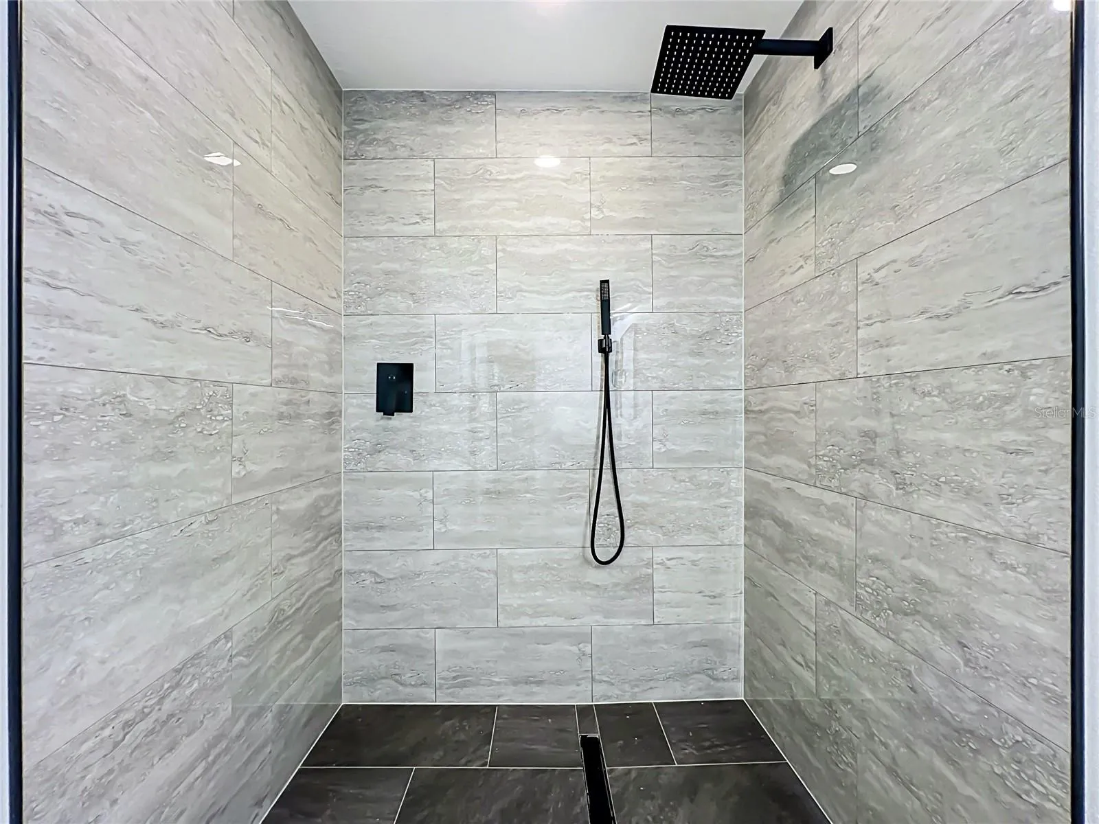 Gorgeous walk-in shower with floor-to-ceiling tile