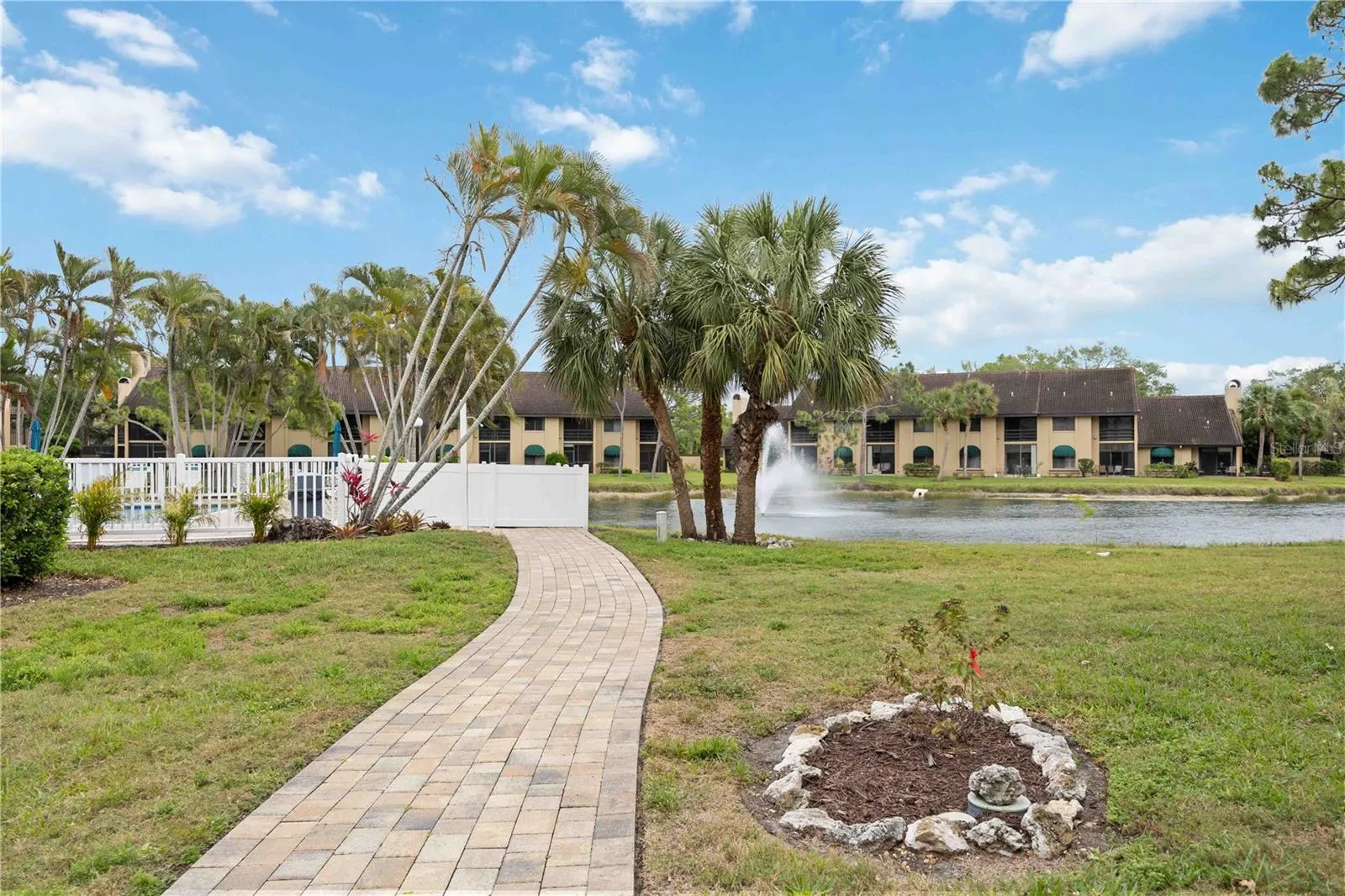 paved pathway to small, heated pool