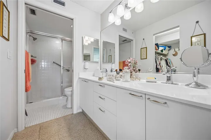 master vanity and walk-in shower