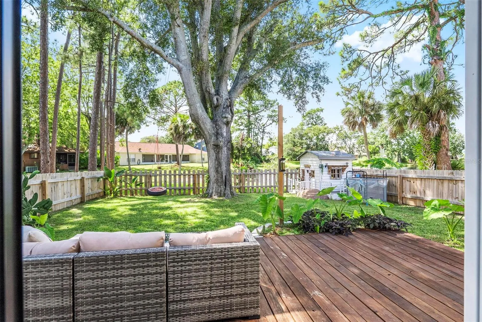 Backyard with decking &amp; tons of shade