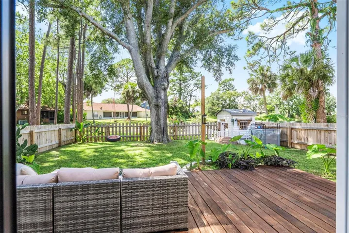 Backyard with decking &amp; tons of shade