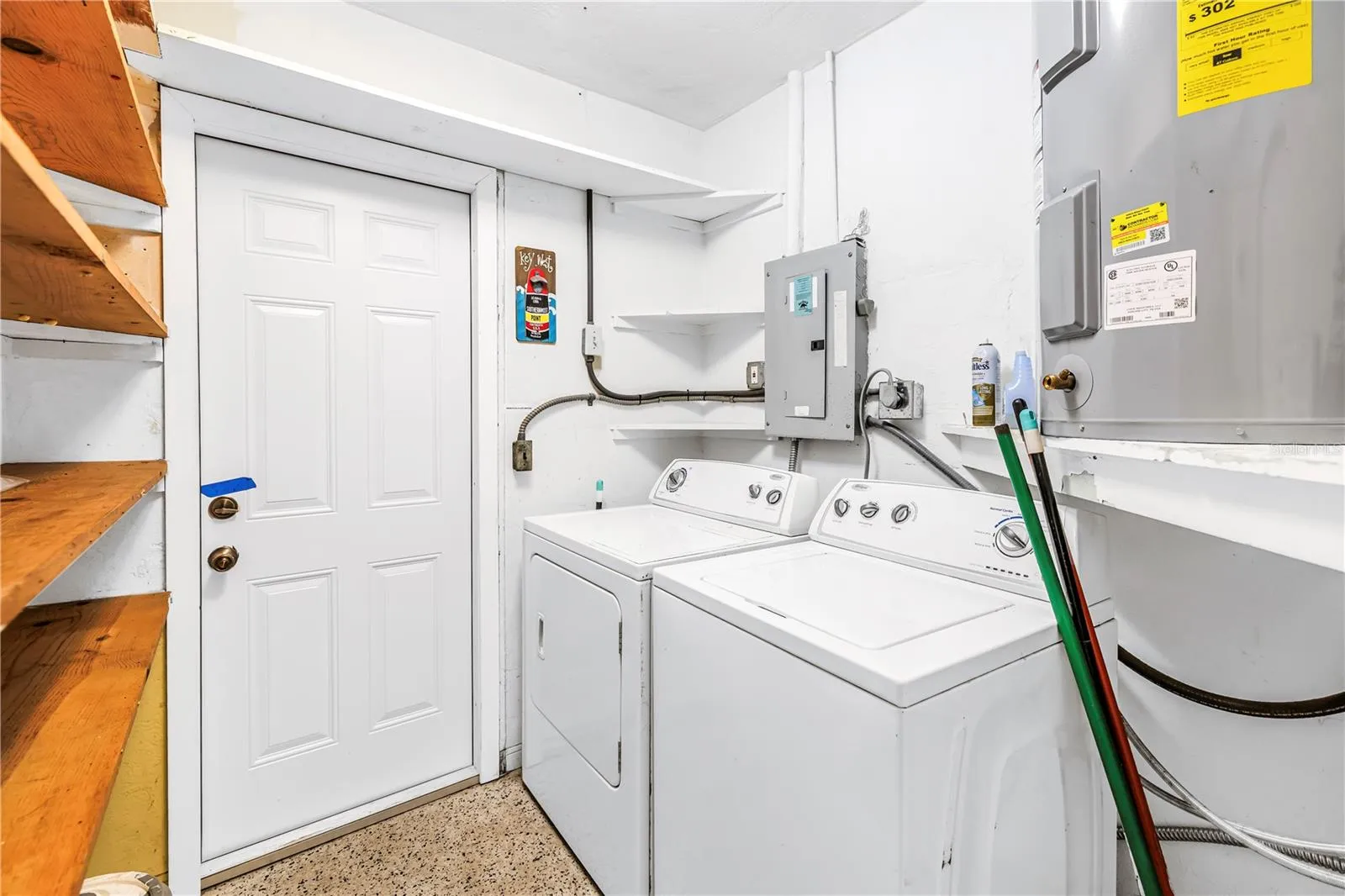 Washer and dryer room- inside but no designated ac vent. Access to backyard.