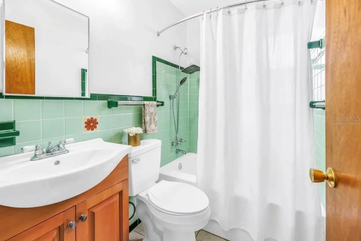 Bathroom with tub- virtually staged shower curtain