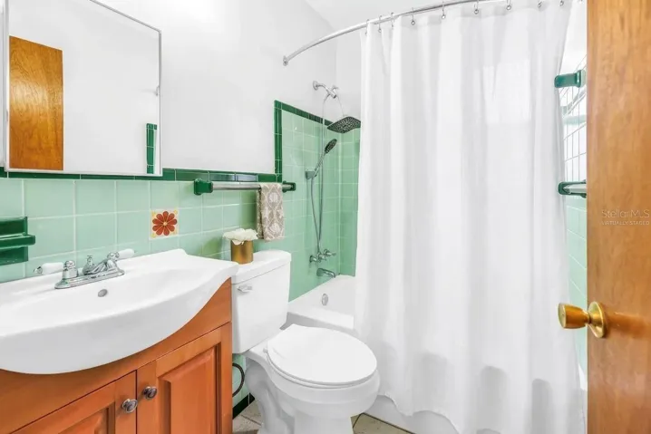 Bathroom with tub- virtually staged shower curtain