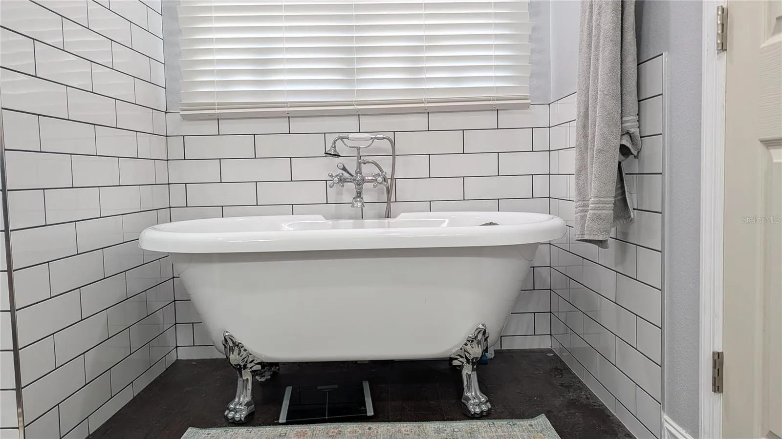 lovely claw foot tub for soaking your cares away.