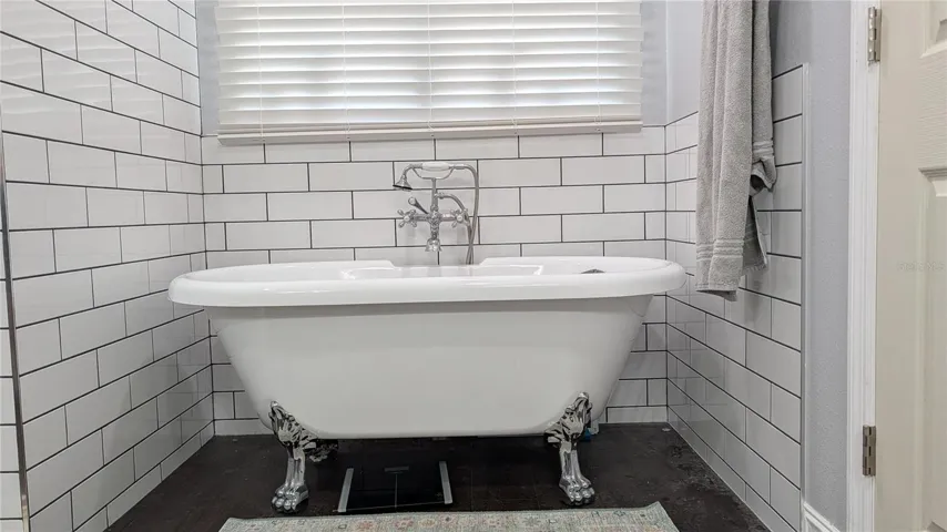 lovely claw foot tub for soaking your cares away.