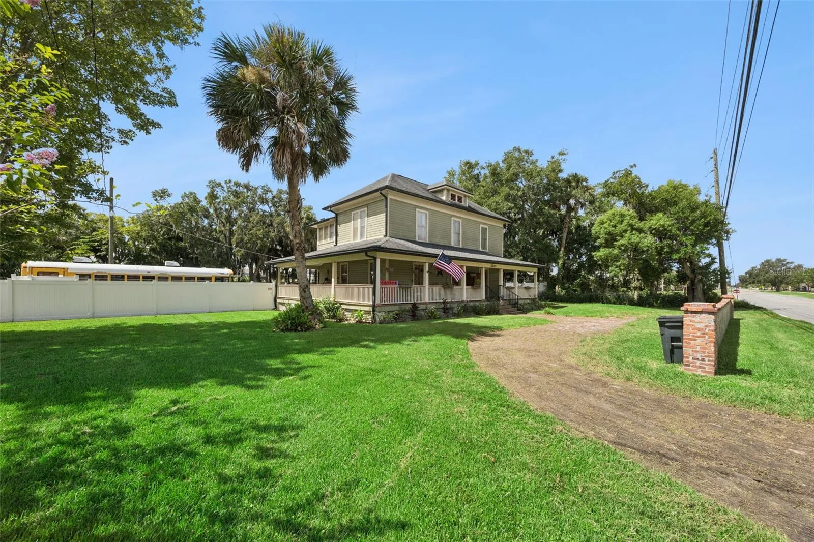 A large backyard with mature shade trees, firepit area and outbuildings creates a setting rarely found this close to Sanford.