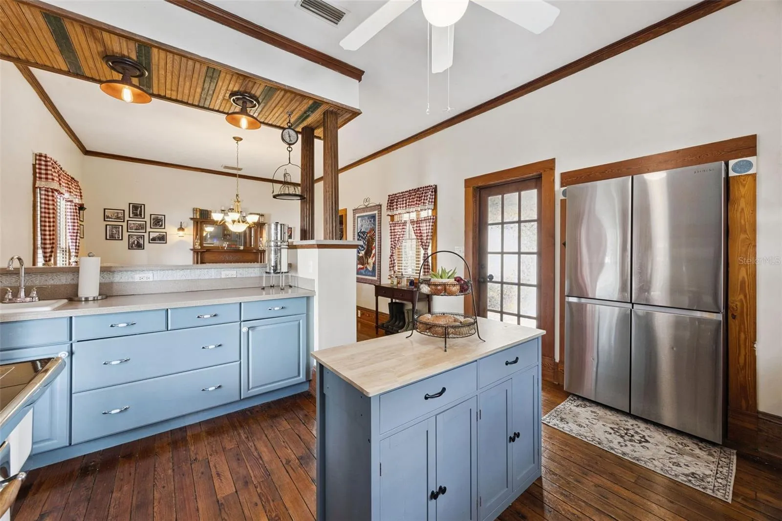 The kitchen offers a center island, abundant cabinetry and a natural connection to the adjoining dining space.