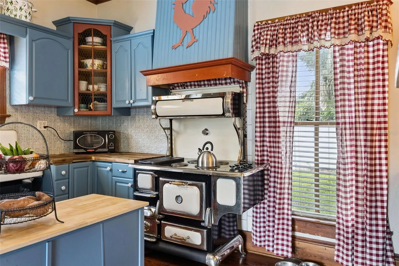 A statement range adds unforgettable vintage character to a kitchen designed to complement the home's history.