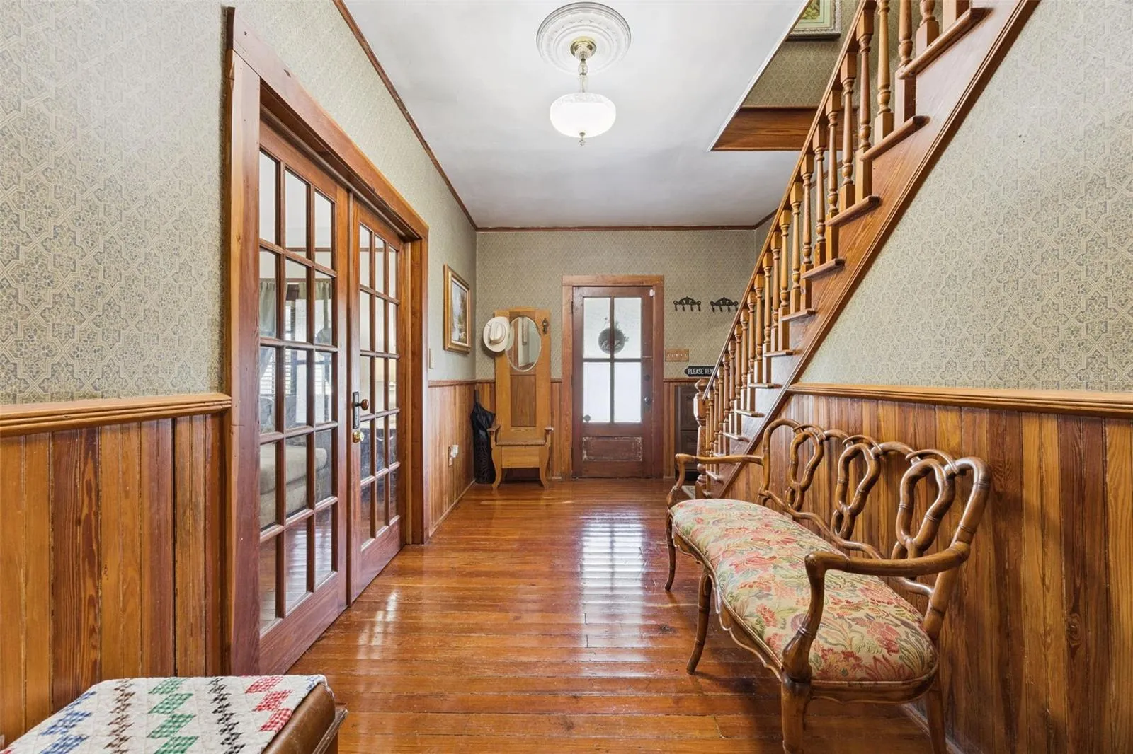 Step inside to original wood floors, rich millwork, French doors and a beautiful staircase that immediately establish the home's historic character.