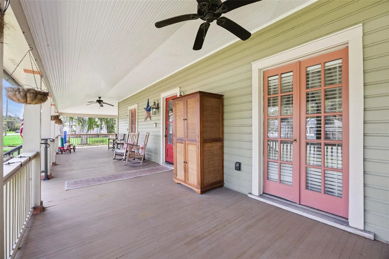 Slow down and stay awhile — multiple seating areas make the wraparound porch an extension of the home's living space.