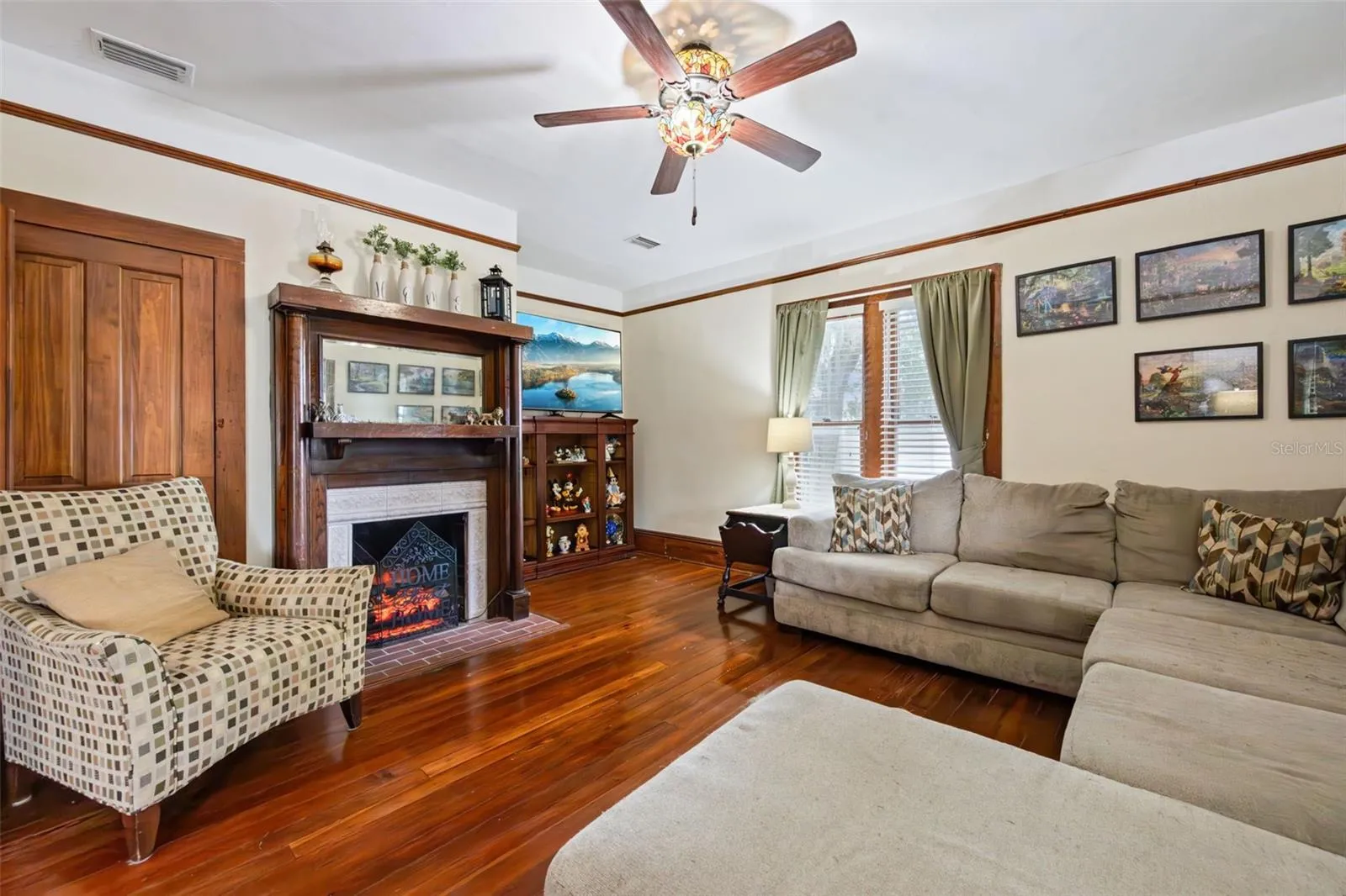Original woodwork and a beautifully detailed staircase anchor the gracious central hall.