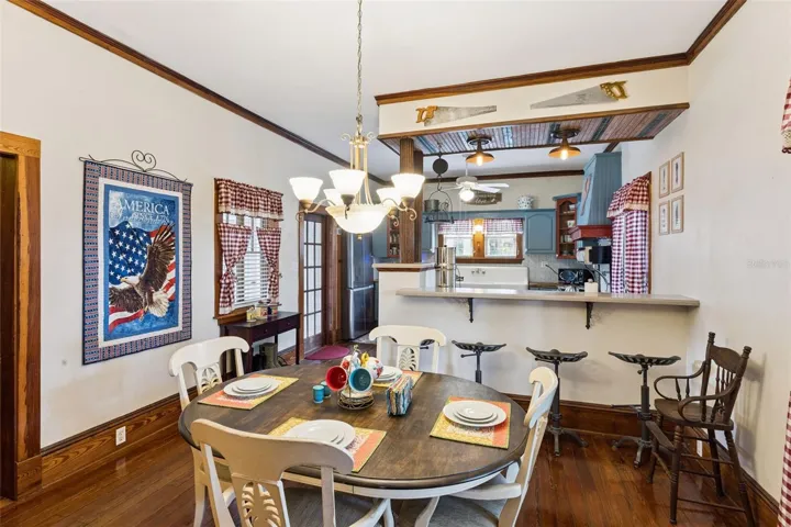 The generous dining room features another fireplace, original wood floors and an easy connection to the kitchen.