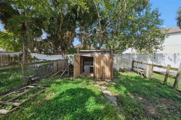 Beyond the pool, the property opens into fenced areas offering room for gardening, animals and a variety of outdoor uses.