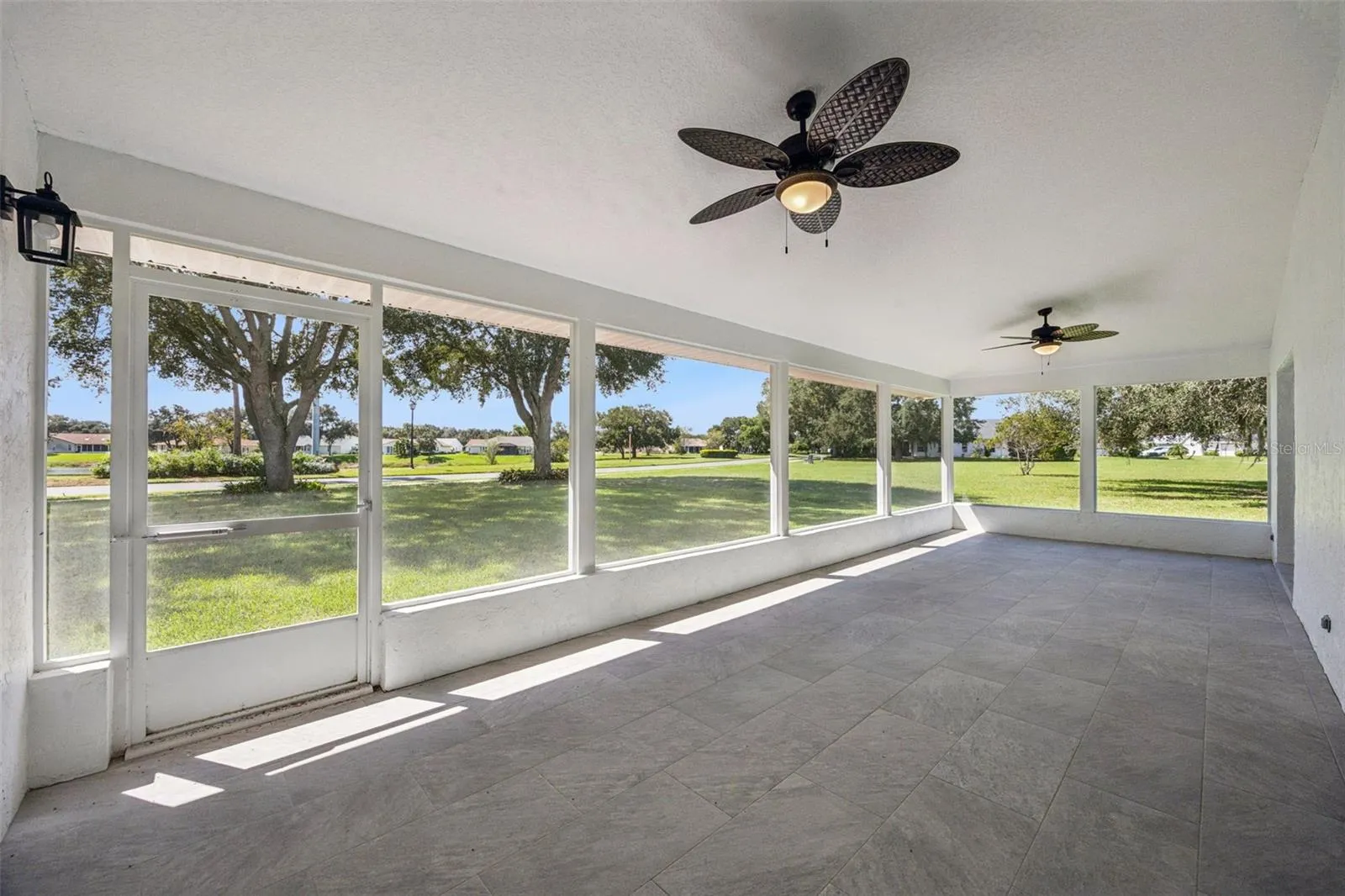 covered patio/lanai (accessible from dining/kitchen, Primary Bedroom and guest bath