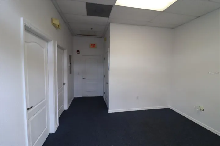 main area with 2 office doors and the warehouse door.