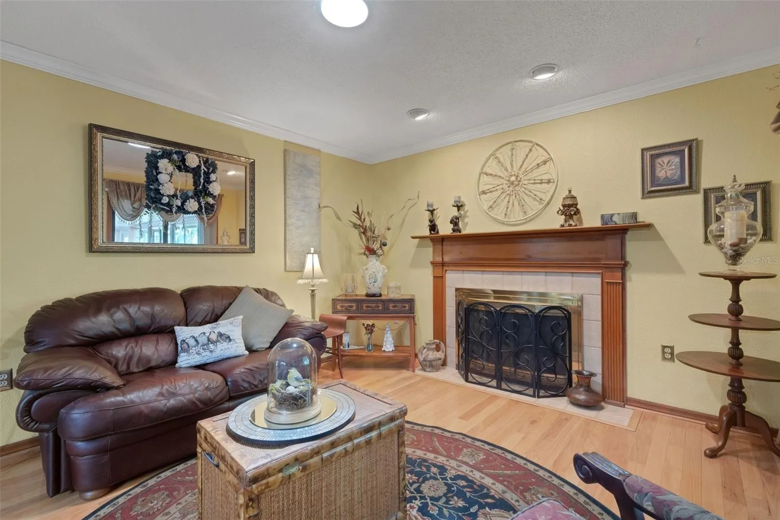 PRIMARY BEDROOM SEATING AREA WITH FIREPLACE