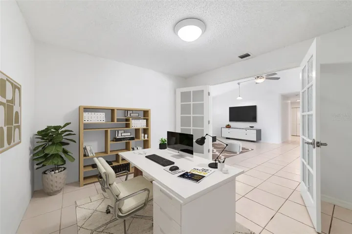 Office/flex behind French doors. Virtually Staged.