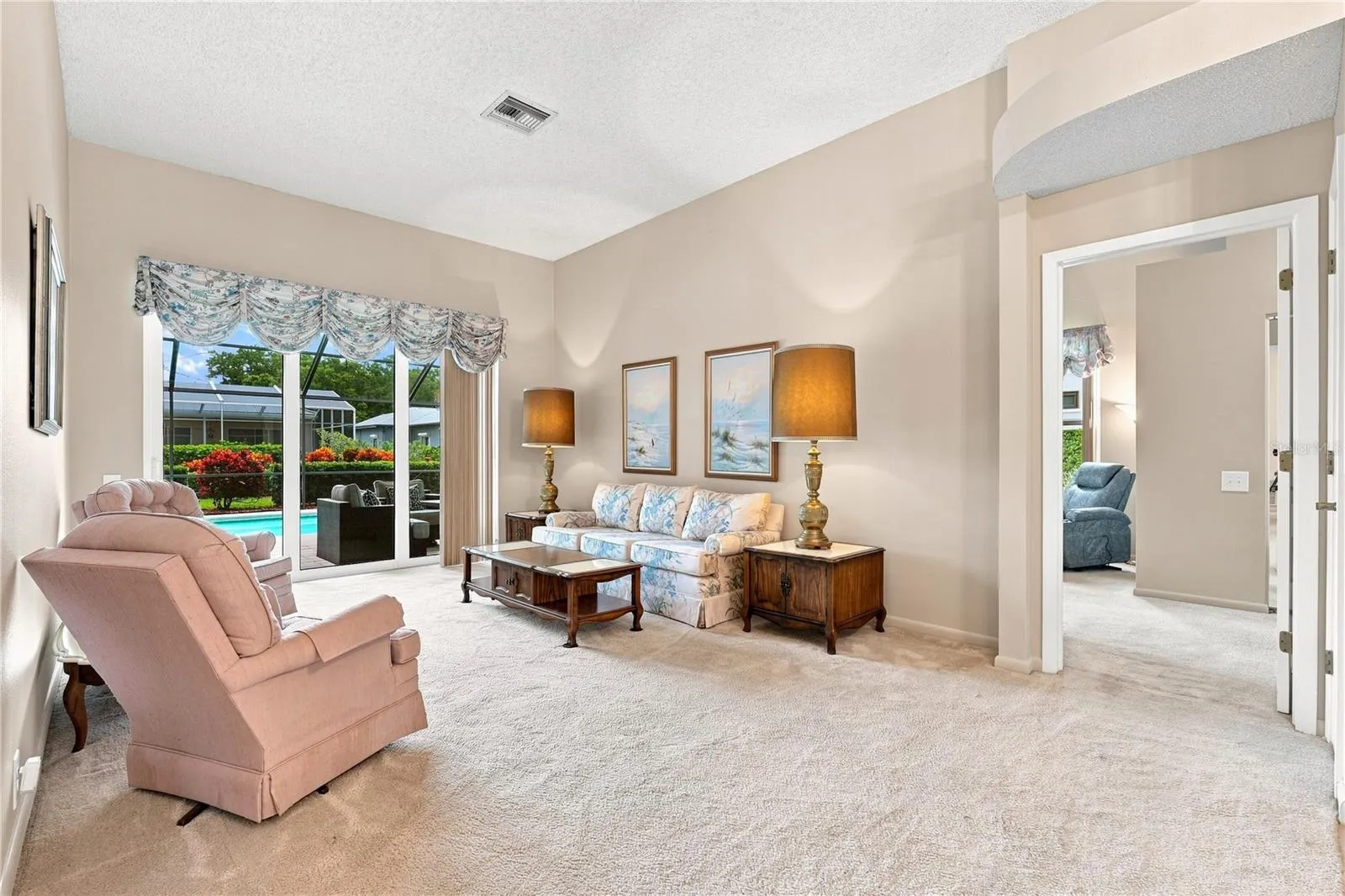 Living Area that goes through the Pool Area & Primary Bedroom