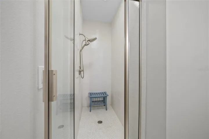 Private Guest Ensuite with beautifully updated shower and new flooring throughout