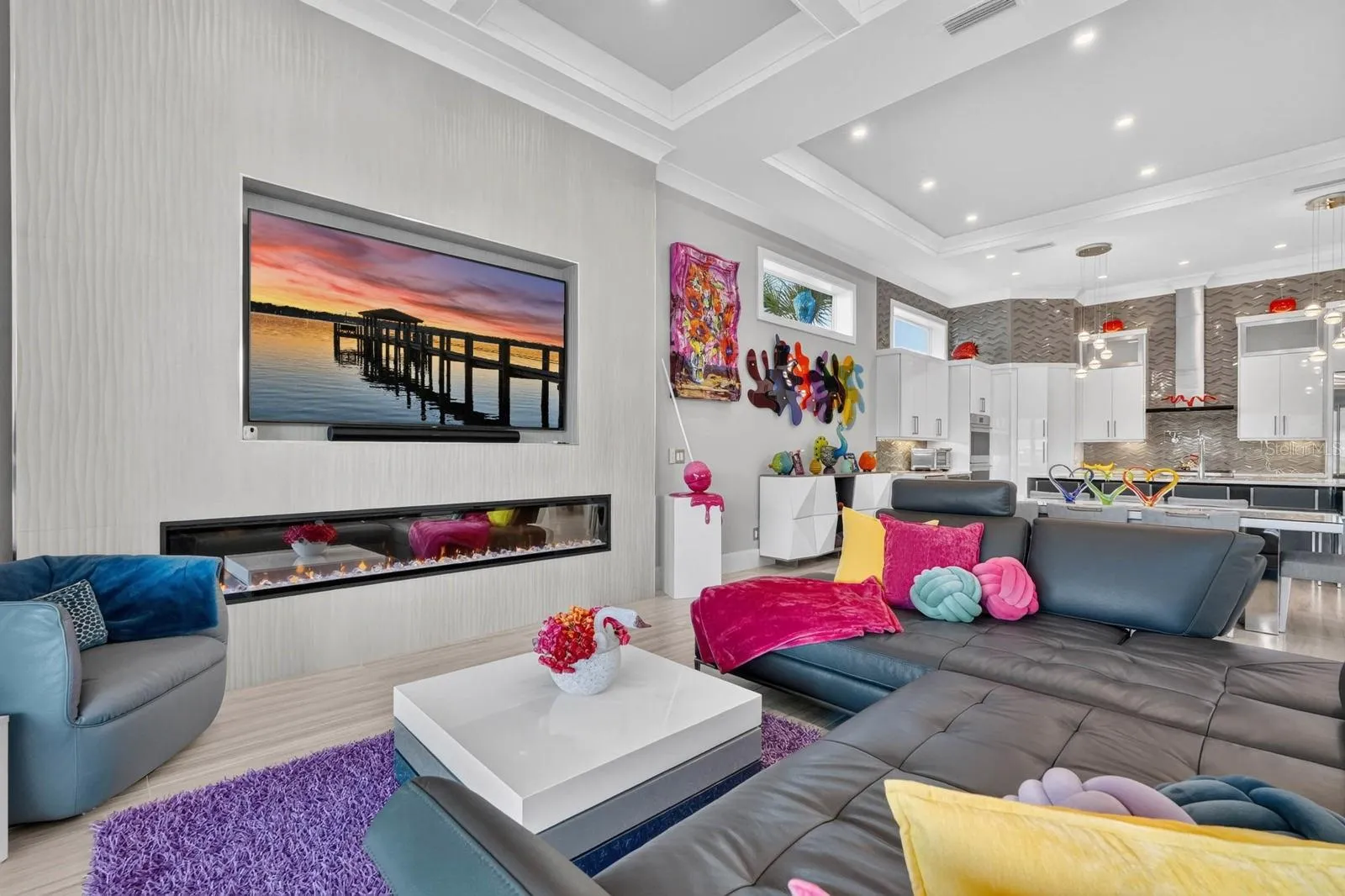 Grand enough to accommodate everyone, yet cozy enough for everyday living. The kitchen, dining, living and outdoor spaces flow together in a way that makes this entire first floor simply feel like home.