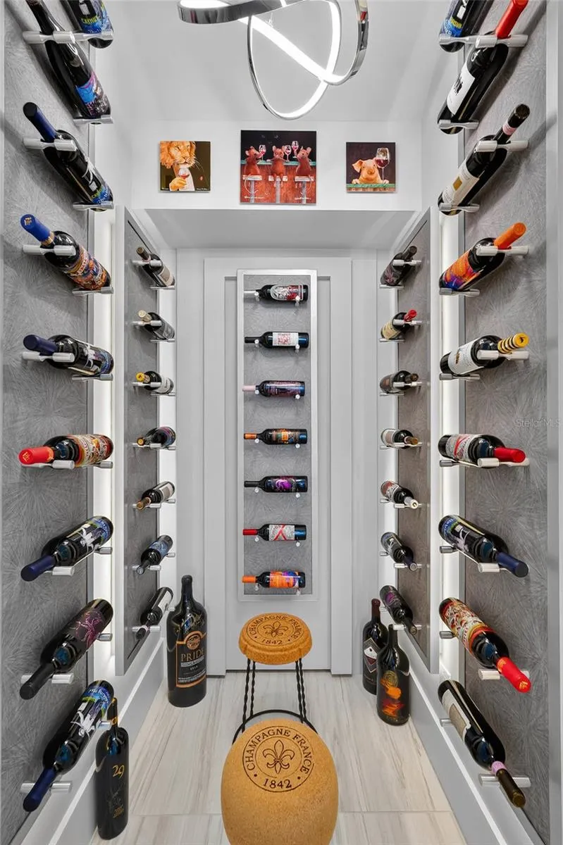 Now this is a wine room. Custom illuminated bottle displays transform this dedicated space into something that feels as much like an art installation as wine storage.