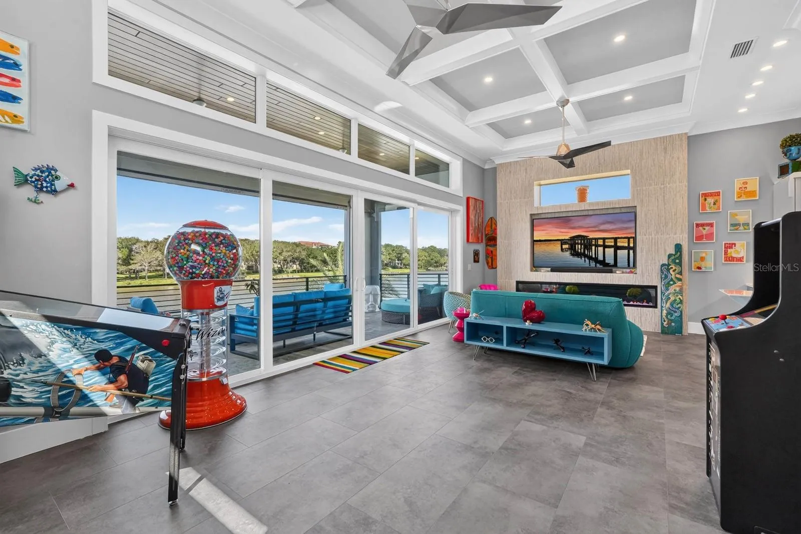 Who says the fun has to stay downstairs? A dedicated second-floor gathering space with fireplace, wet bar, game area and expansive balcony overlooking the Intracoastal.