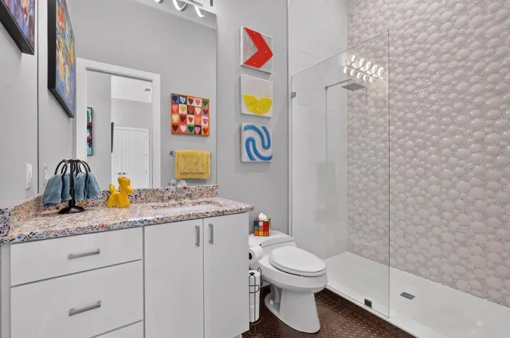 Can we just talk about this shower tile? Such a fun detail and another example of how this home refuses to be ordinary.