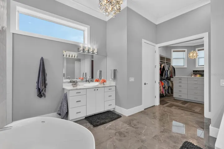 Separate vanities and a beautifully appointed walk-in dressing room… all part of the private owner’s level.
