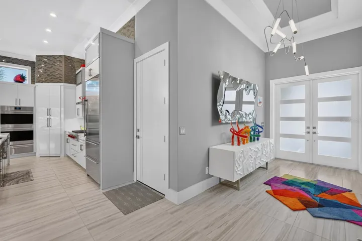 The details start the moment you walk in. Soaring ceilings, smooth-finish walls, designer lighting and custom solid-wood doors set the tone.
