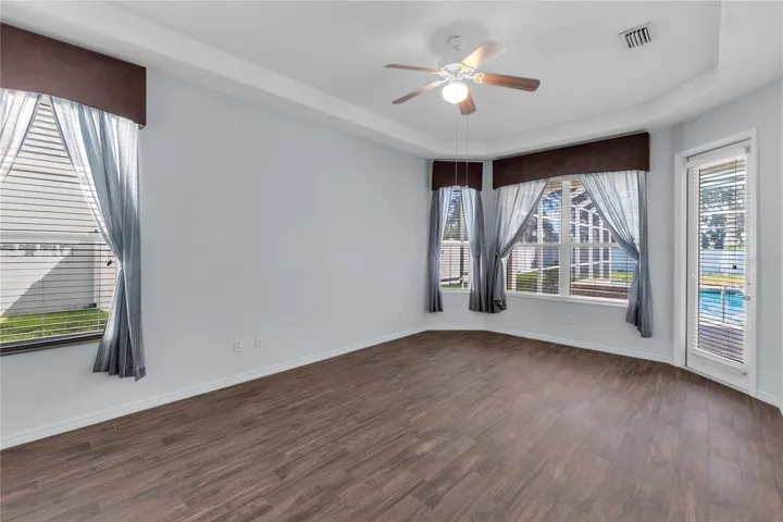 Primary Bedroom with private access to Pool/Patio