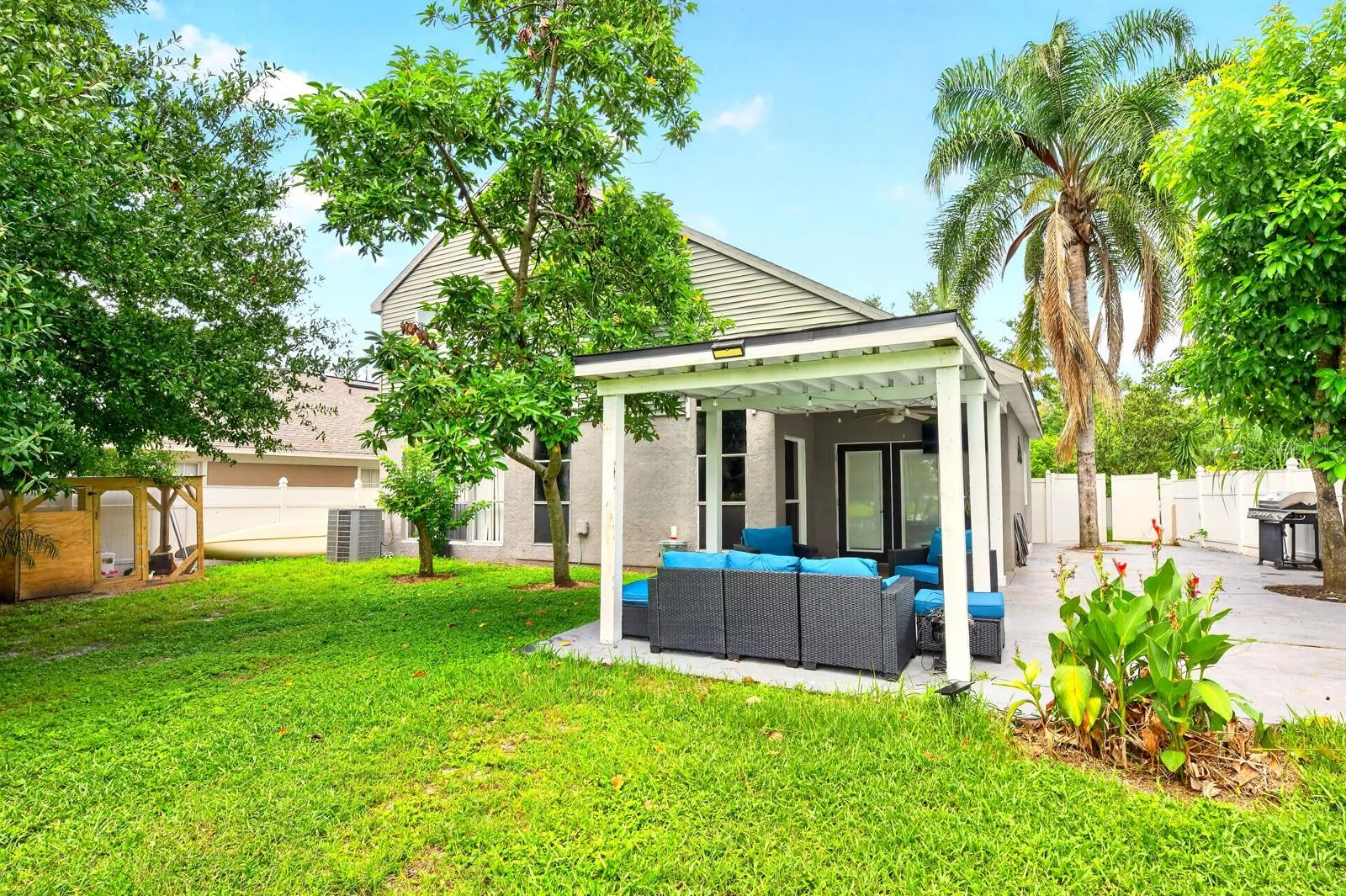 Step outside where the VINYL-FENCED YARD takes full advantage of the PEACEFUL LAKE SETTING as you relax on the COVERED PATIO and enjoy the water view.